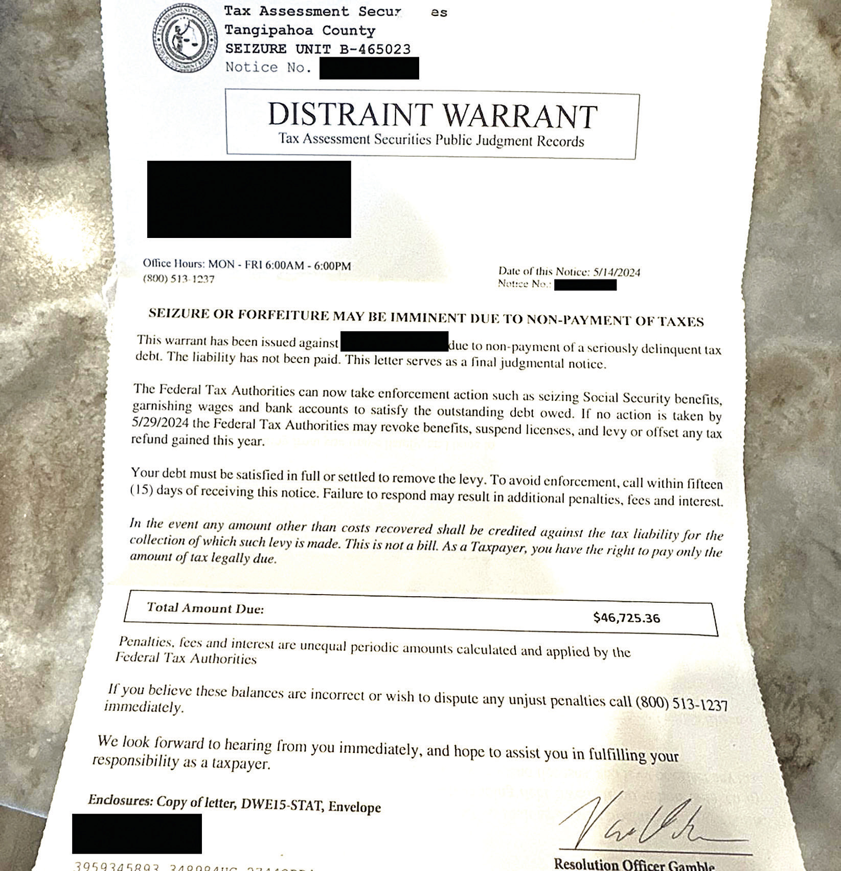 Photo of a letter received by the victim (personal information redacted)